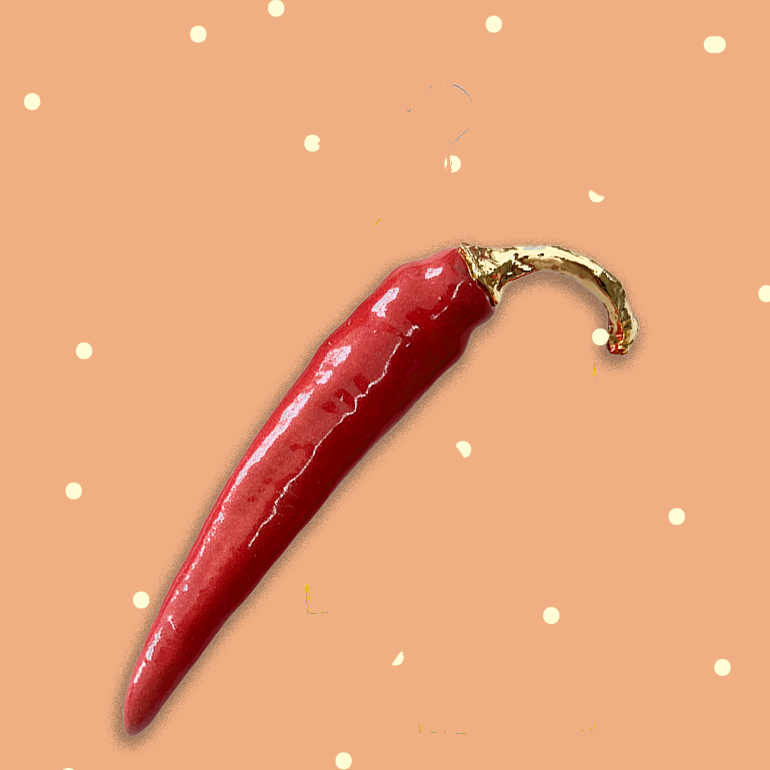 Porseleinen peper in rood en goud